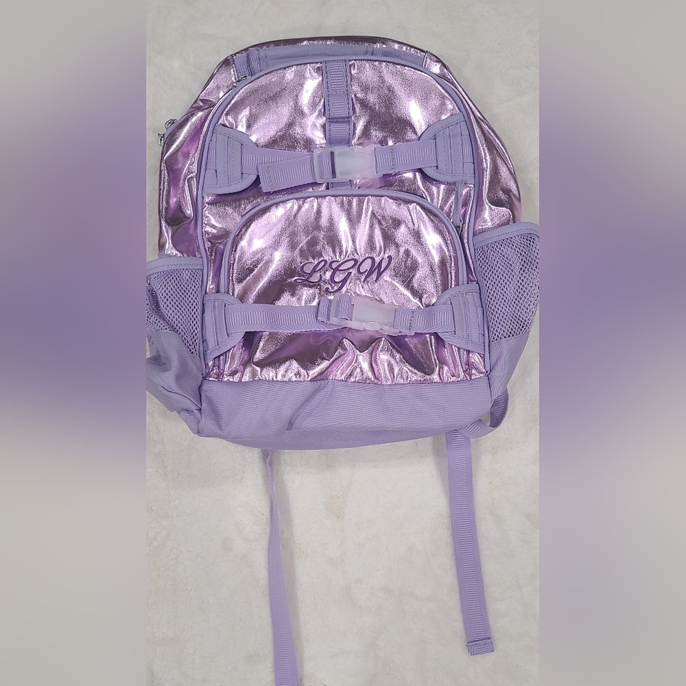 Girl metallic "Mckenzie " backpack from pottery barn kids.  Initials LGW sewn in
